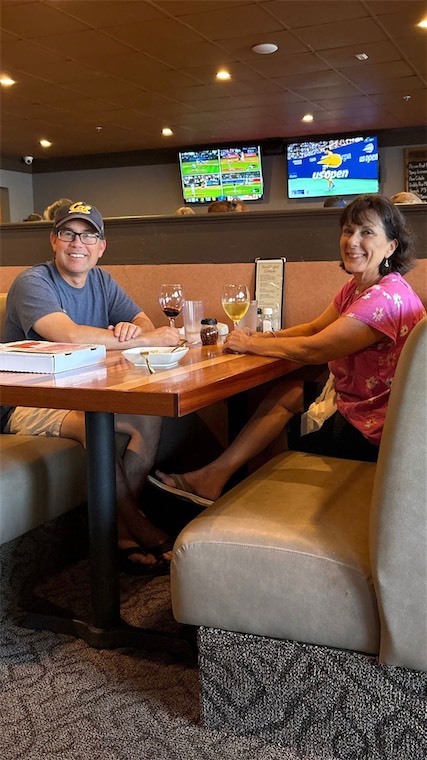 Guests sharing a meal in a DeVino's booth