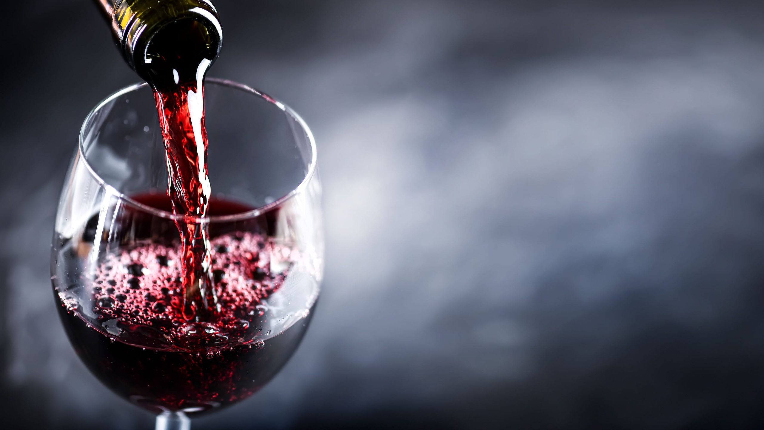 Red wine being poured into a wine glass
